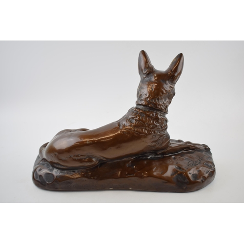 328 - Mid century plaster model of a lying alsatian, with impressed signature / reg number, 40cm long.