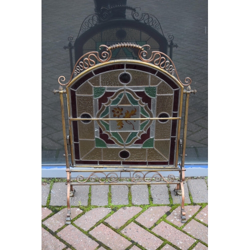 287 - Arts and Crafts firescreen with copper and brass decoration and stained glass insert with floral des... 