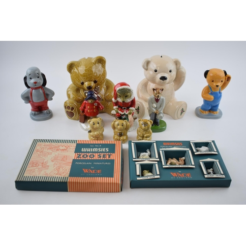 113 - A collection of Wade to include Paddington Bear, Sooty and Sweep, Whimsies Zoo Set No. 8, money boxe... 