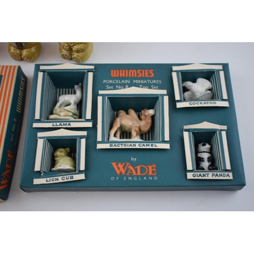 113 - A collection of Wade to include Paddington Bear, Sooty and Sweep, Whimsies Zoo Set No. 8, money boxe... 