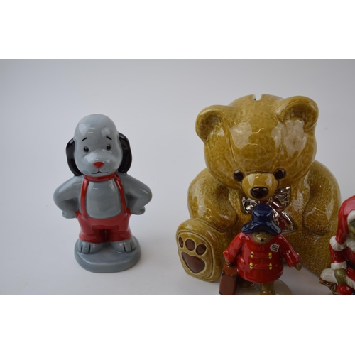 113 - A collection of Wade to include Paddington Bear, Sooty and Sweep, Whimsies Zoo Set No. 8, money boxe... 