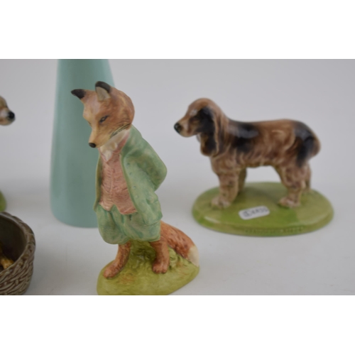 125 - A collection of ceramic items to include Wade Championship series dogs,Wade puppy in basket, John Be... 