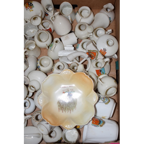 127 - A collection of crested china items to include animals, jugs, vases and varying forms and decoration... 