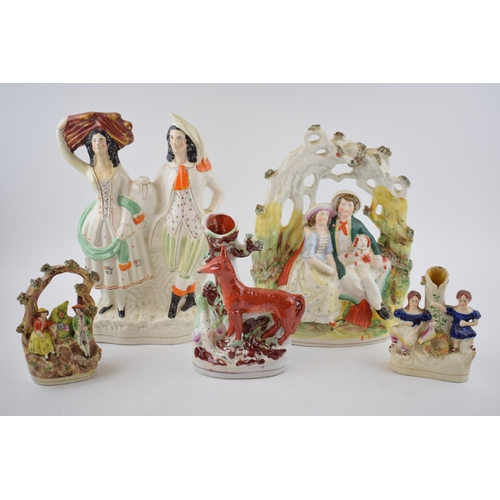 129 - A collection of Staffordshire flatback figures to include a fox with romantical scenes (Qty)