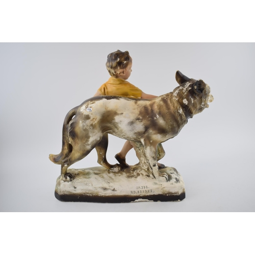 146 - Mid century chalk ware figure of a boy with Alsatian / German Shepherd dog.