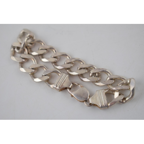 173 - Sterling silver heavy curb link bracelet, 40.0 grams, 22cm.