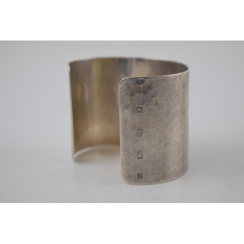 175 - Sterling silver hammered wide bangle, 65.2 grams, 52mm wide, London 2011, M C Hersey & Son Ltd (Stew... 