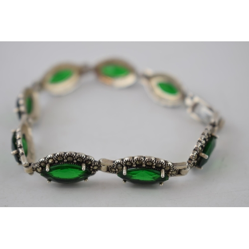 220 - Sterling silver bracelet set with green stones, 18.5 grams, 20cm long.