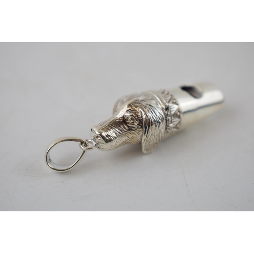 230 - Sterling silver whistle in the form of a dog's head, 5cm long.