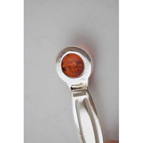 232 - Sterling silver bookmark with an amber style insert, 6cm long.