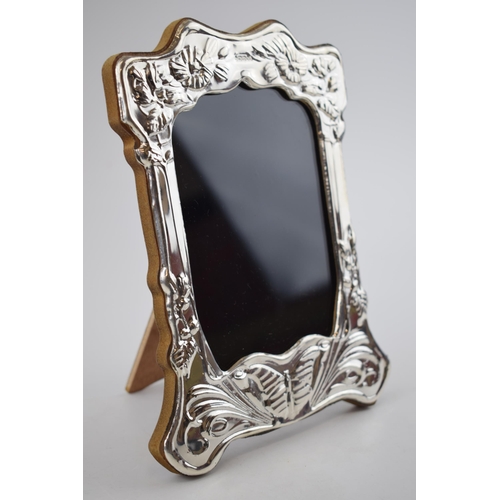 236 - Hallmarked silver photo frame with wooden easel back, with butterfly decoration, 21cm tall, London 2... 