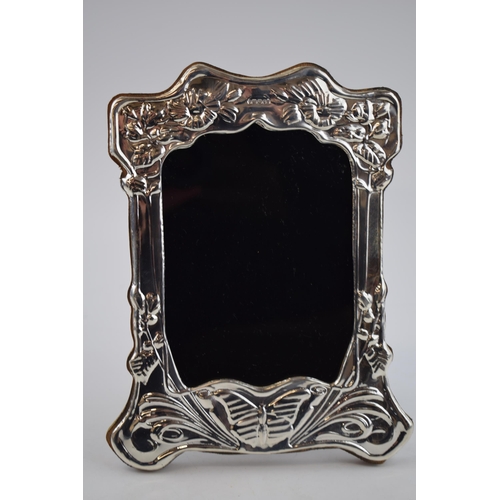 236 - Hallmarked silver photo frame with wooden easel back, with butterfly decoration, 21cm tall, London 2... 