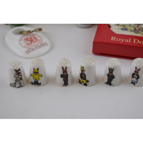 89 - Royal Doulton Bunnykins items to include Christmas Tree decorations, a miniature Flower Sellers Chil... 