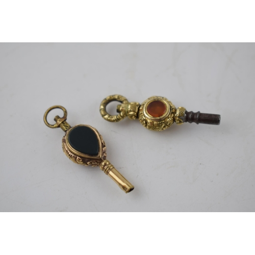 195 - A pair of vintage ornate yellow metal watch keys, with hard stone inserts, 6.6 grams (2).