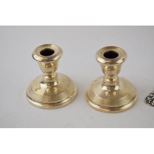 249 - A pair of Walker and Hall silver ornate candlesticks, Sheffield 1900, loaded, gross weight 240 grams... 