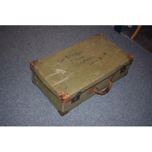 258 - A vintage green canvas trunk with leather handle with name CAPT. D.C.N Byass 7th Hussars, 127 Piccad... 