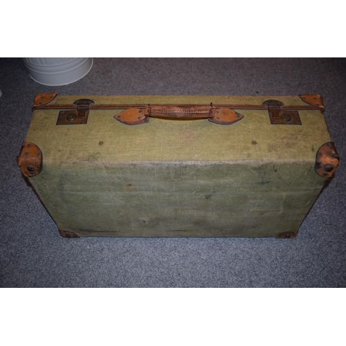 258 - A vintage green canvas trunk with leather handle with name CAPT. D.C.N Byass 7th Hussars, 127 Piccad... 