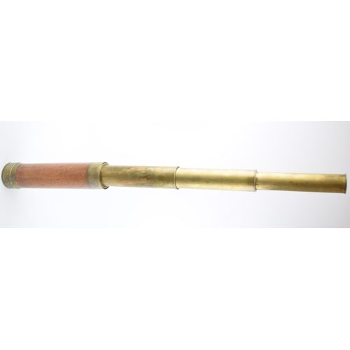 267 - Antique telescope with wooden grip and brass banding. Length 71cm.