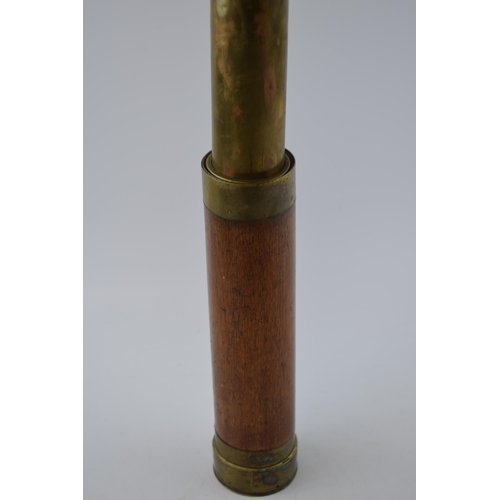 267 - Antique telescope with wooden grip and brass banding. Length 71cm.