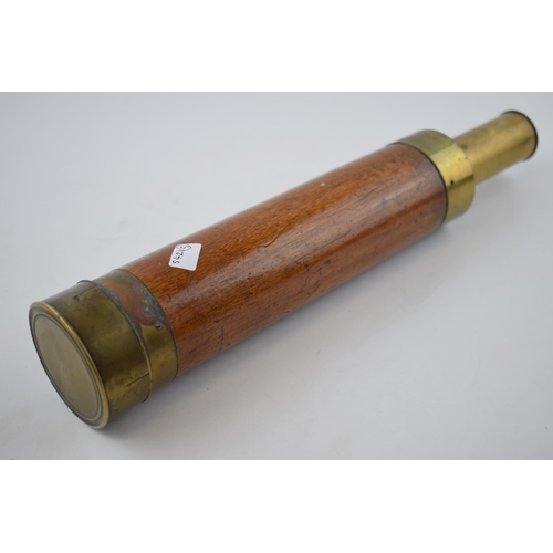 267 - Antique telescope with wooden grip and brass banding. Length 71cm.