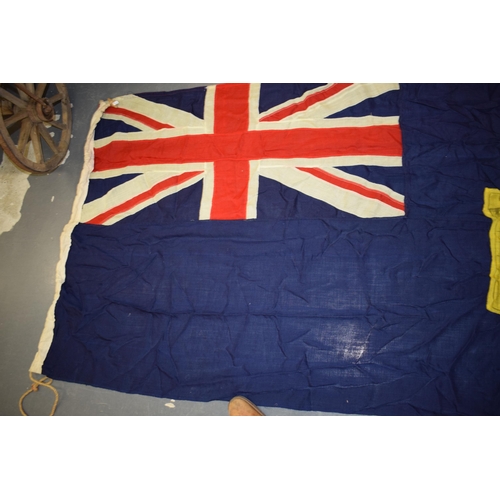 270 - A panel stitched flag with castle motif. 214cm x 95cm.