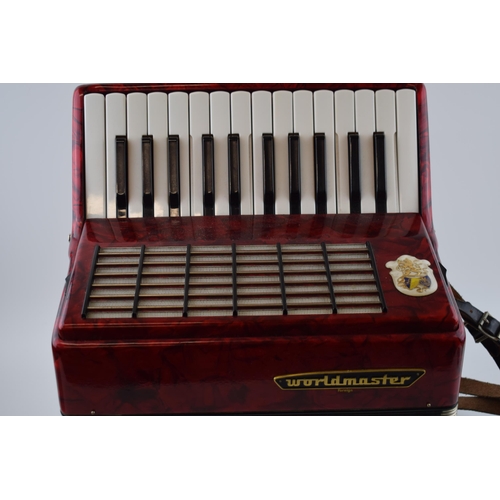 273 - Cased Worldmaster Accordion decorated with red lacquer in working order.