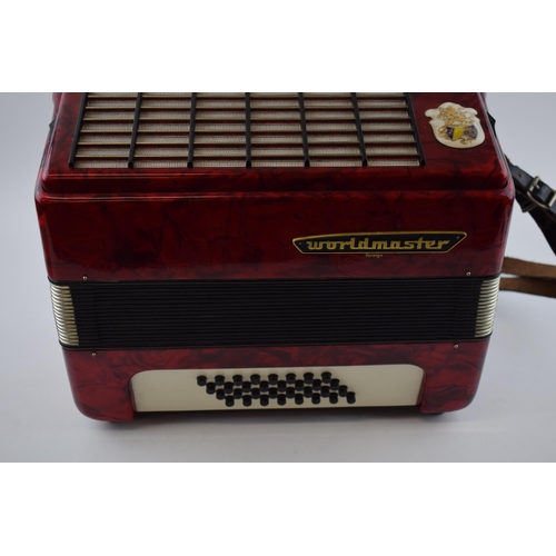 273 - Cased Worldmaster Accordion decorated with red lacquer in working order.