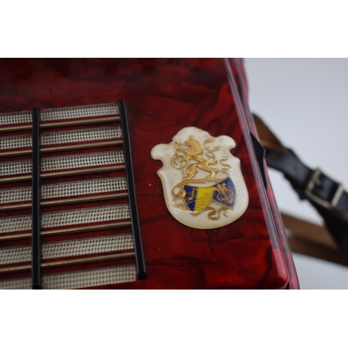 273 - Cased Worldmaster Accordion decorated with red lacquer in working order.