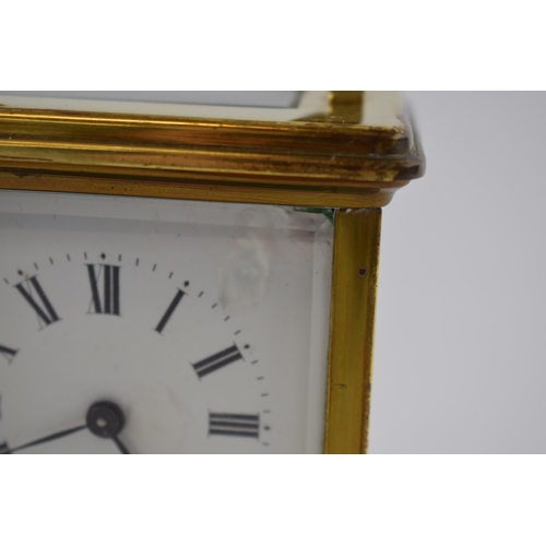 278 - A brass cased carriage clock by Wilson & Gill of Regent Street London. Bevelled glass, roman numeral... 