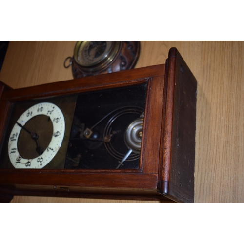 279 - A wall clock with ceramic dial and pendulum movement together with a barometer. (2)