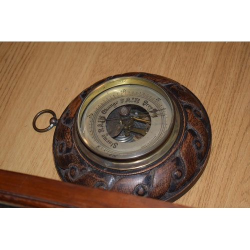 279 - A wall clock with ceramic dial and pendulum movement together with a barometer. (2)