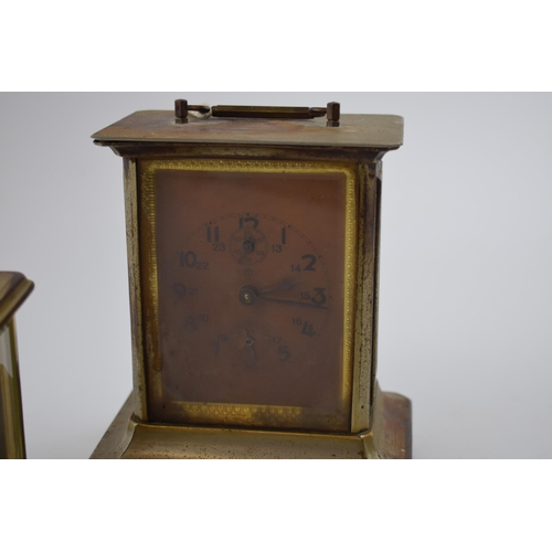 280 - A carriage clock with bevelled glass 'London Clock Co' (height 14.5cm)  together with another simila... 