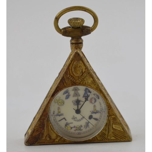 281 - Bronze style Masonic triangular clock, with top wind, 6.5cm tall, in working order.