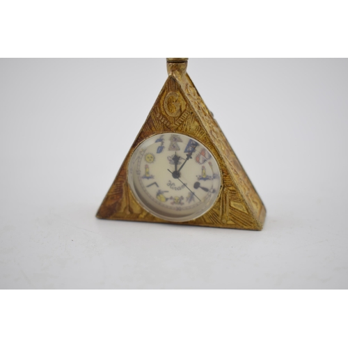 281 - Bronze style Masonic triangular clock, with top wind, 6.5cm tall, in working order.