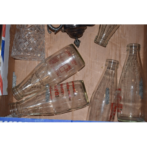 292 - A collection of vintage dairy bottles to include Peak and Davies Dairies with 2 silver plated claret... 