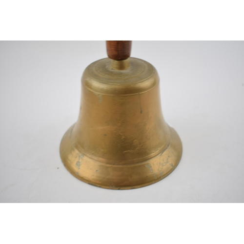 296 - Brass school type bell marked with crows-foot. Height 27cm.