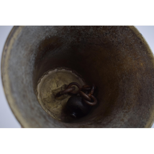 296 - Brass school type bell marked with crows-foot. Height 27cm.