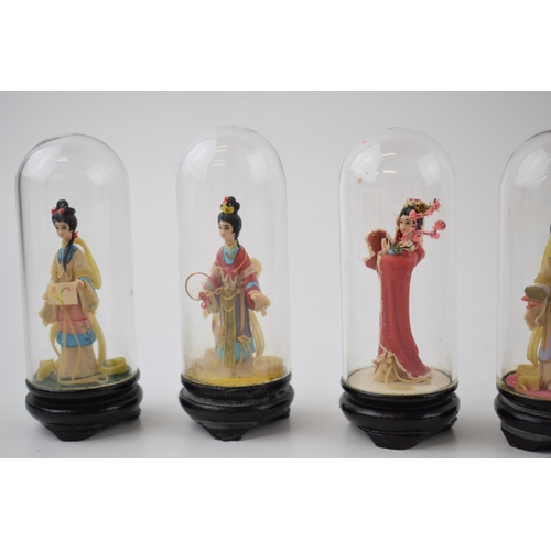 304 - A collection of vintage miniature figures of ladies in original costume under glass domes. Height 10... 