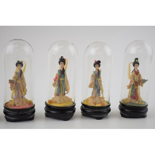 304 - A collection of vintage miniature figures of ladies in original costume under glass domes. Height 10... 