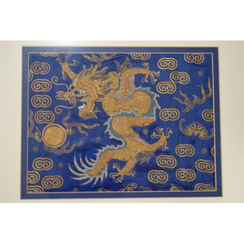 307 - Two Chinese emborideries on silk, one of a dragon and another of a plants in a naturalistic setting.... 