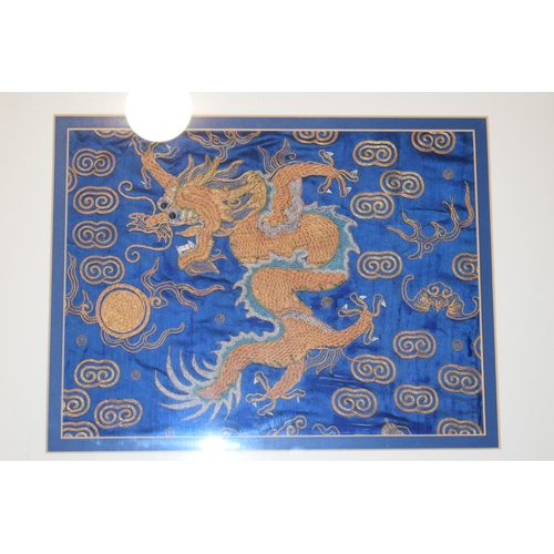 307 - Two Chinese emborideries on silk, one of a dragon and another of a plants in a naturalistic setting.... 