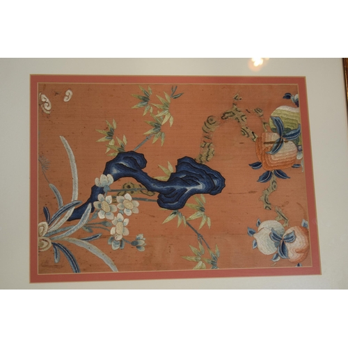 307 - Two Chinese emborideries on silk, one of a dragon and another of a plants in a naturalistic setting.... 