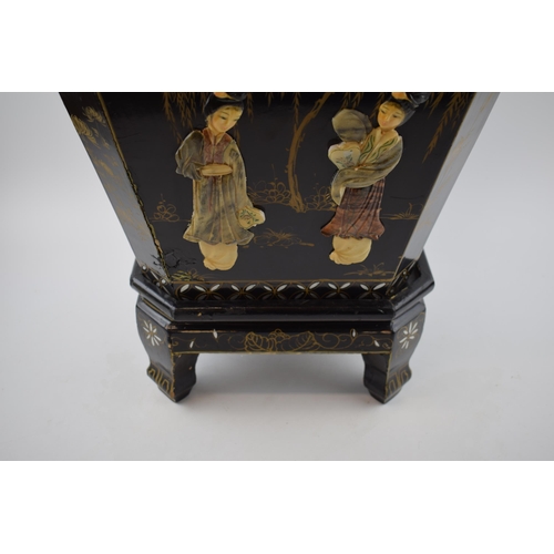 310 - Oriental black lacquered planter on stand with applied figural scenes. Wooden base with tin liner. H... 