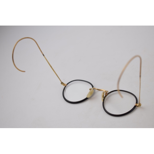 334 - A pair of gentleman's vintage gold plated spectacles Width 11.5cm.