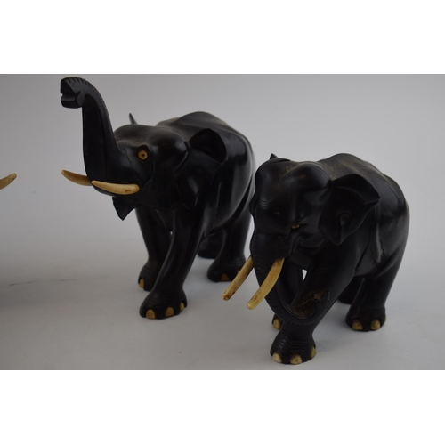 339 - A collection of vintage ebony hand carved elephants. (4)