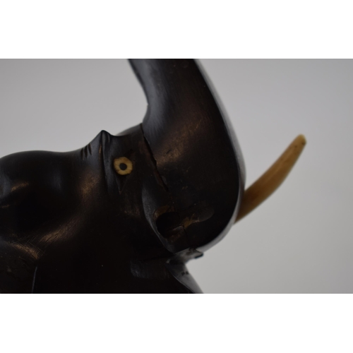 339 - A collection of vintage ebony hand carved elephants. (4)