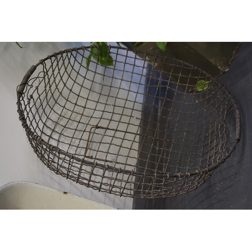 347 - A vintage galvanised potato basket 59cm x 45cm together with a white enamel tray 51cm x 53cm. (2)