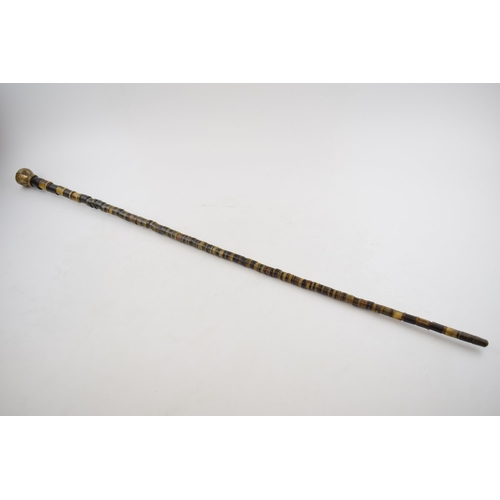 364 - Antique walking cane made of bone beads with brass top and ferrel. Length 84cm.