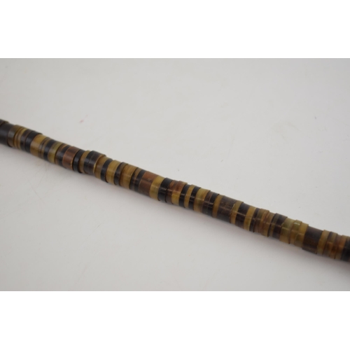 364 - Antique walking cane made of bone beads with brass top and ferrel. Length 84cm.