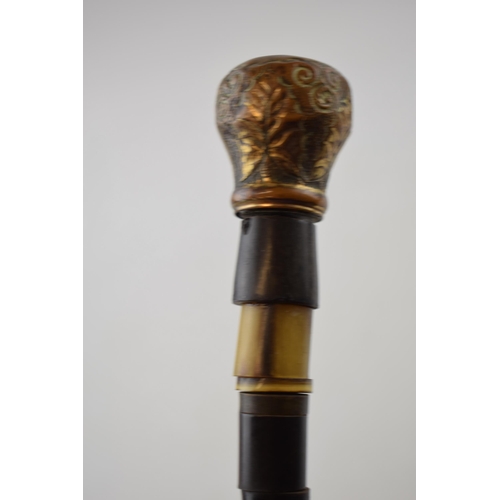 364 - Antique walking cane made of bone beads with brass top and ferrel. Length 84cm.